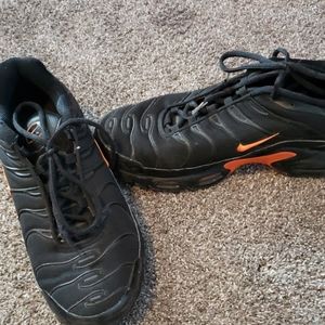 Black and orange Nikes